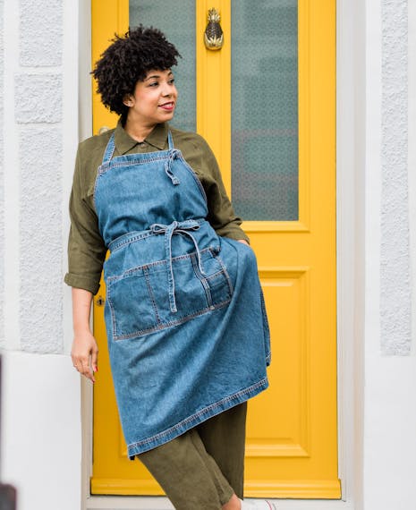 image of nena foster against a bright yellow door