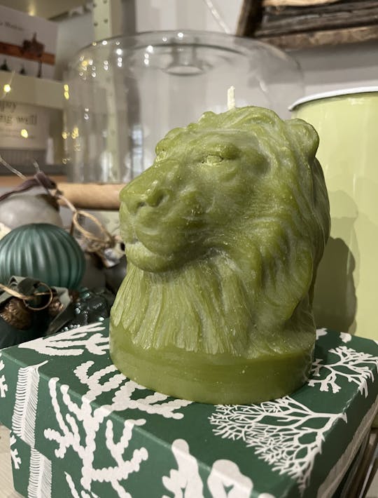 lion's head candle in olive green